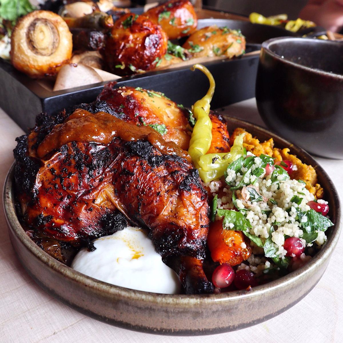 Grilled chicken with pomegranate and herbs at Hafla Hafla